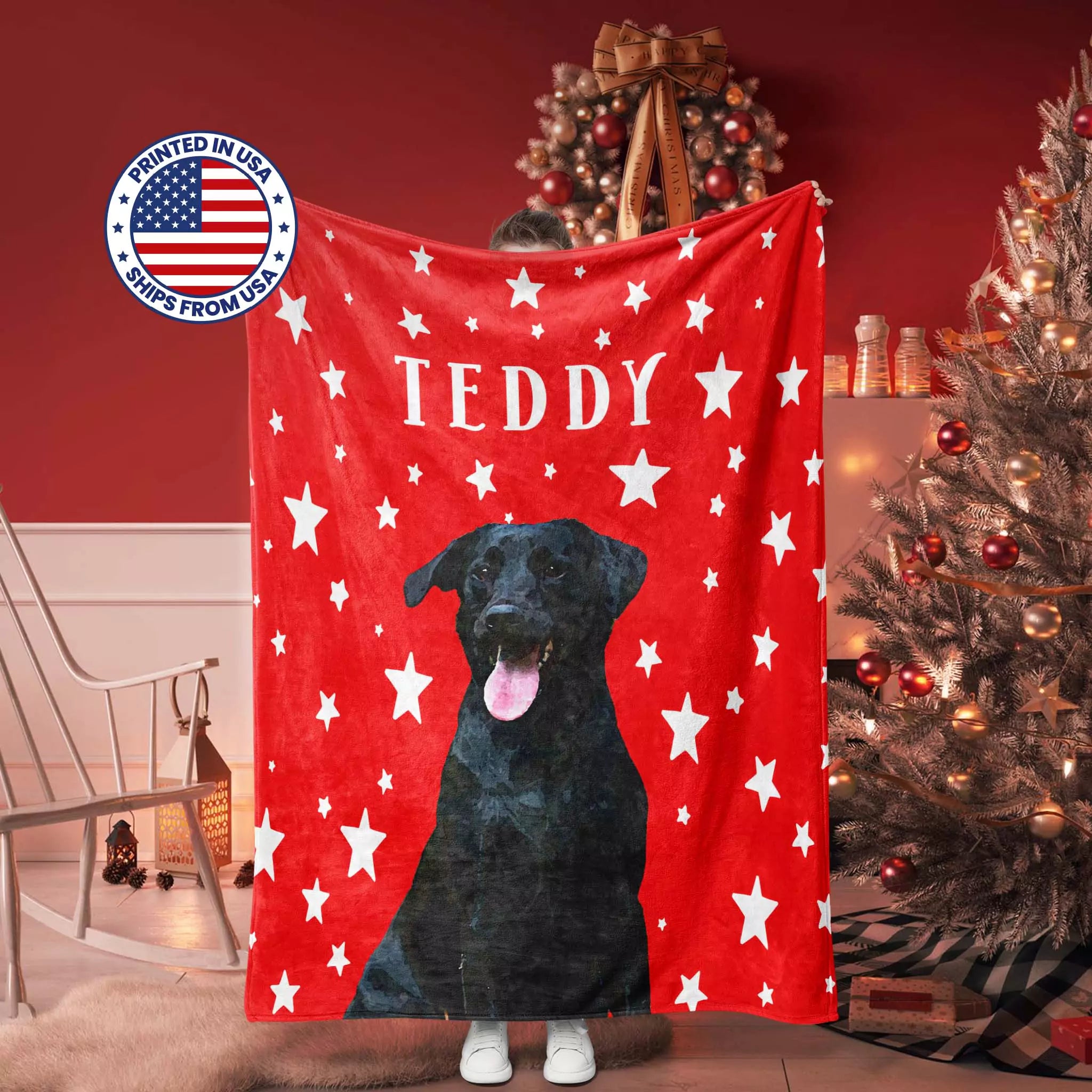 Red dog blanket with a black dog illustration and 'TEDDY' text, displayed in a room with a Christmas tree.