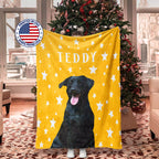 Yellow Christmas dog blanket with a black Labrador dog illustration and 'TEDDY' text, displayed in a room with a Christmas tree.