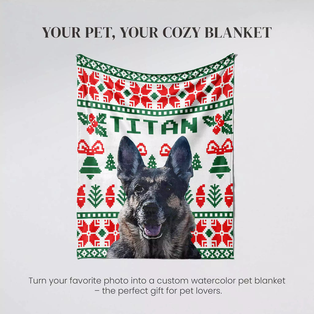 Dog with a custom watercolor dog blanket featuring a pattern and the name 'Titan' on a light gray background.