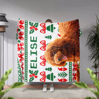 Person holding a Christmas Ugly Sweater Customized Dog Blanket with Poodle with a dog's face and Christmas patterns, with 'Elise' printed on it.