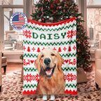 Decorative dog blanket with a dog's face and 'DAISY' text, Christmas tree in the background